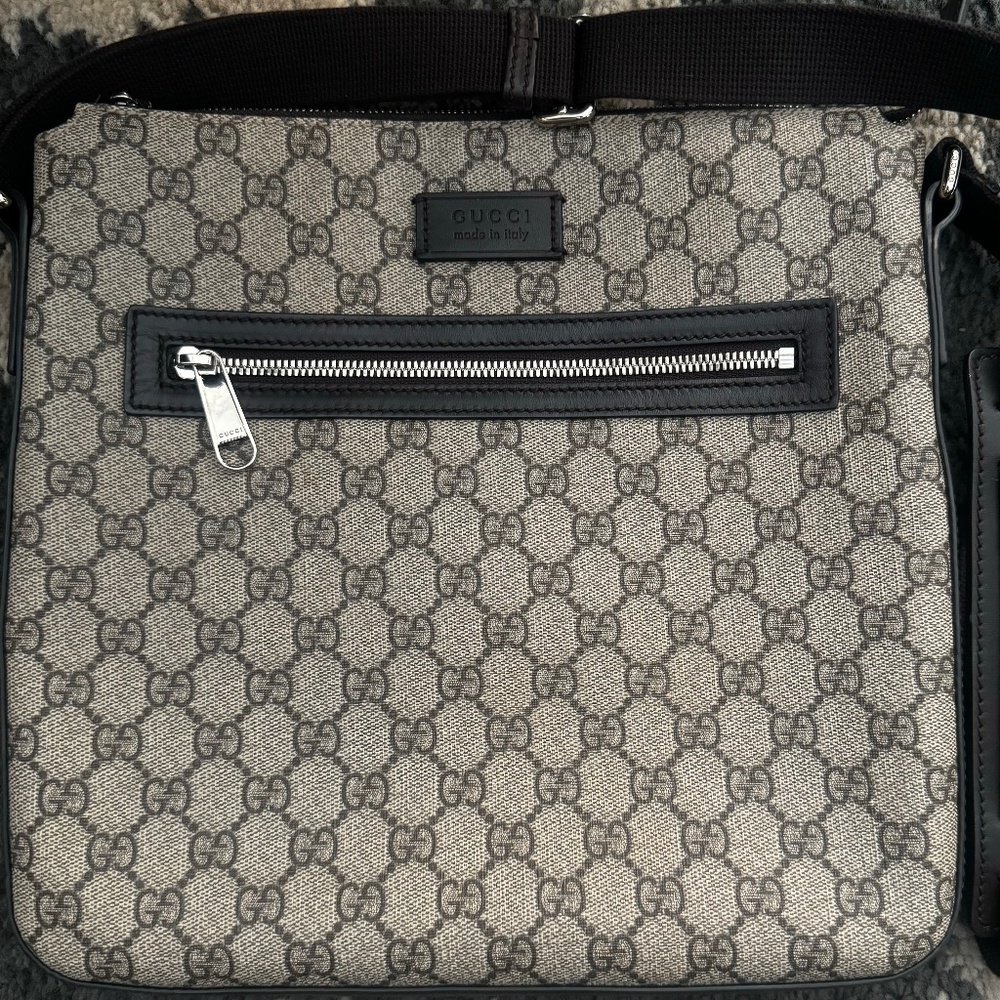 Men’s Gucci monogram messenger bag